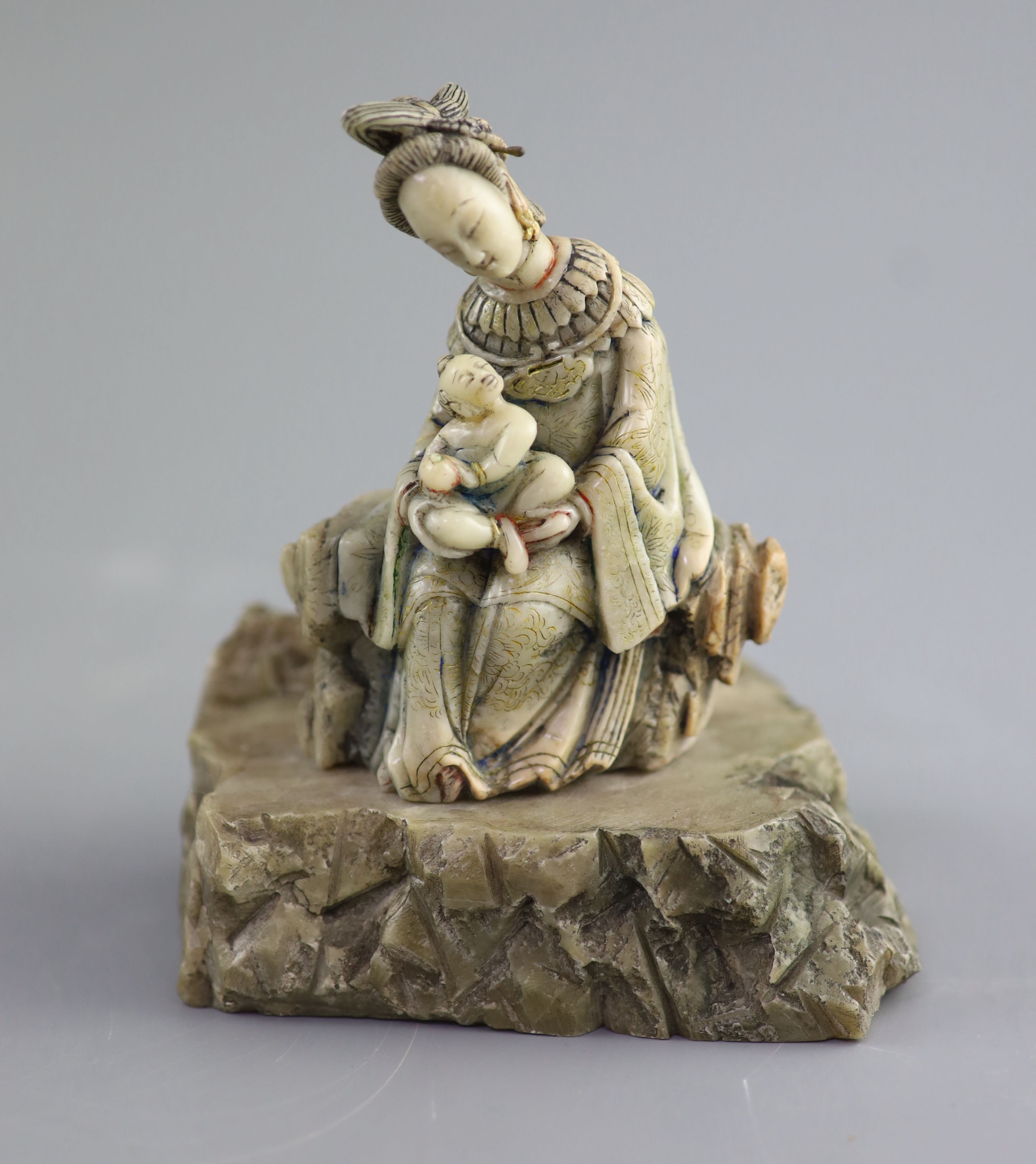 A Chinese soapstone group of Guanyin and child, probably Kangxi period, 15 cm high